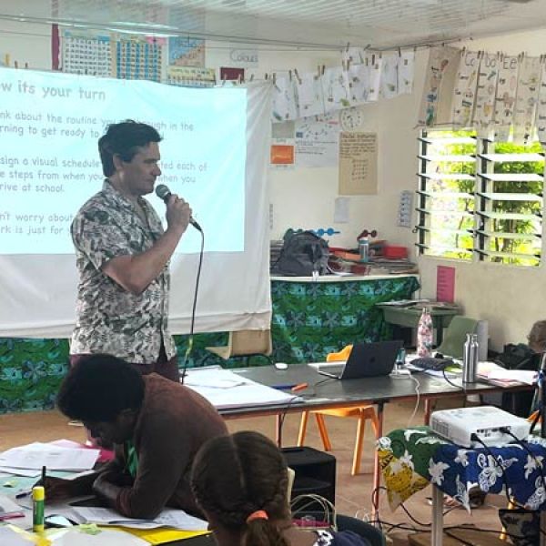 Professor Christopher Boyle teaching in a classroom