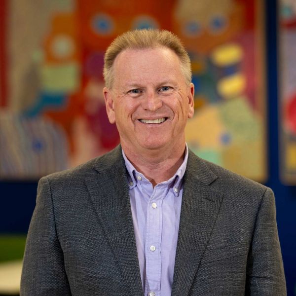 James Skinner web Professor James Skinner in the foyer at NewSpacesmiling at camera