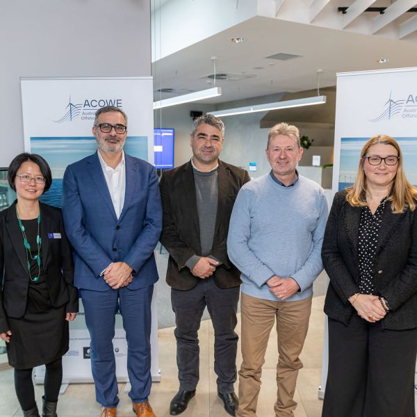 Standing in front of an ACOWE banner and each smiling at the camera: (left to right) Associate Professor Shiaohuey Chow, ACOWE Director, with the ACOWE Steering Committee: Professor Christophe Gaudin, UWA; Associate Professor Daniel Ierodiaconou, Deakin University; Professor Ty Christopher, University of Wollongong; and Professor Anna Giacomini, University of Newcastle. . University of Newcastle researchers to play key role in Offshore Wind Energy progress