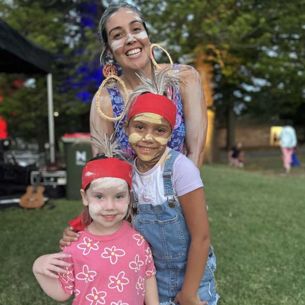 Renae Lamb, Ella and Catelin smiling toward the camera at Ngarrama.. Ngarrama returns to shine light on reconciliation .