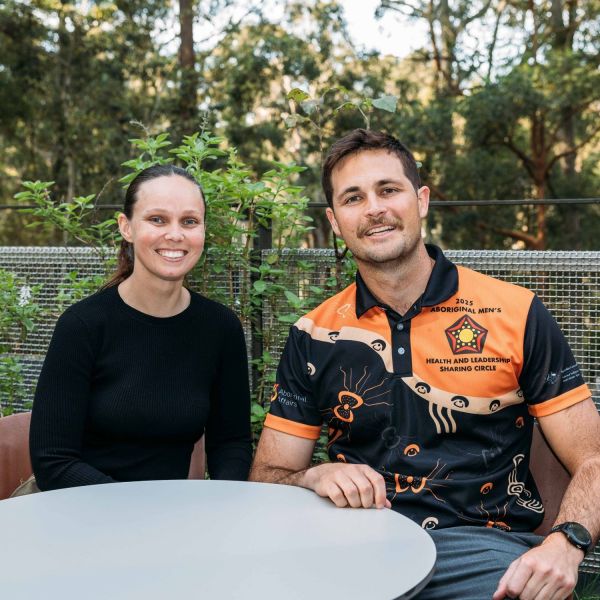 Kayla Faulkner and Jake MacDonald sitting at a table smiling