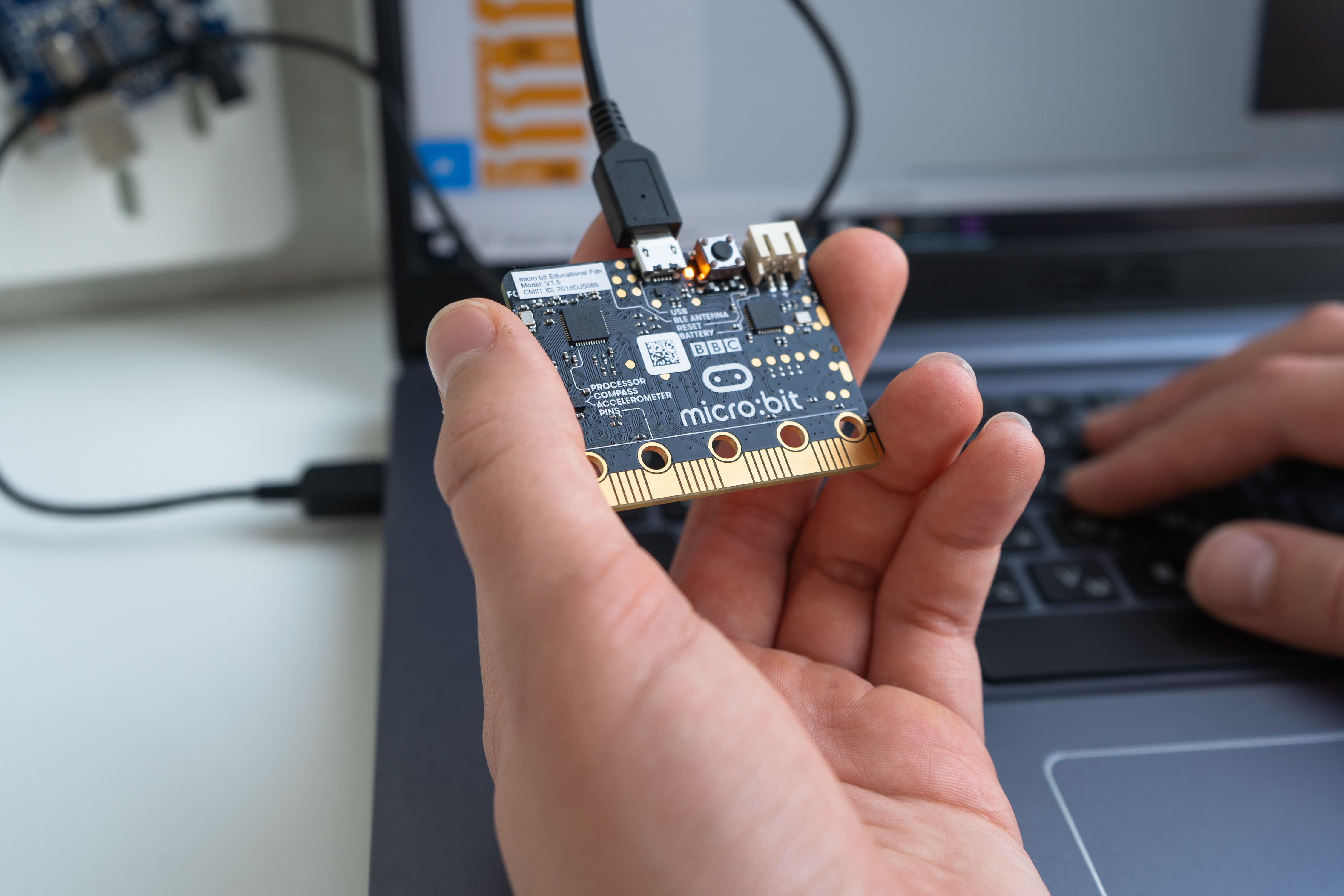 Hand holding a micro:bit