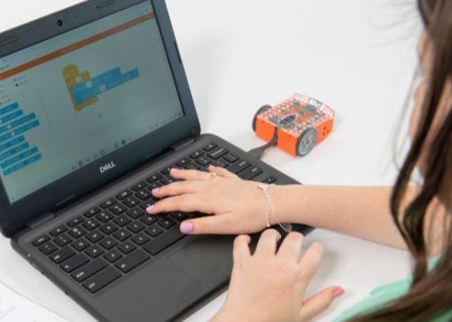 Girl using Computer and Edisons to code