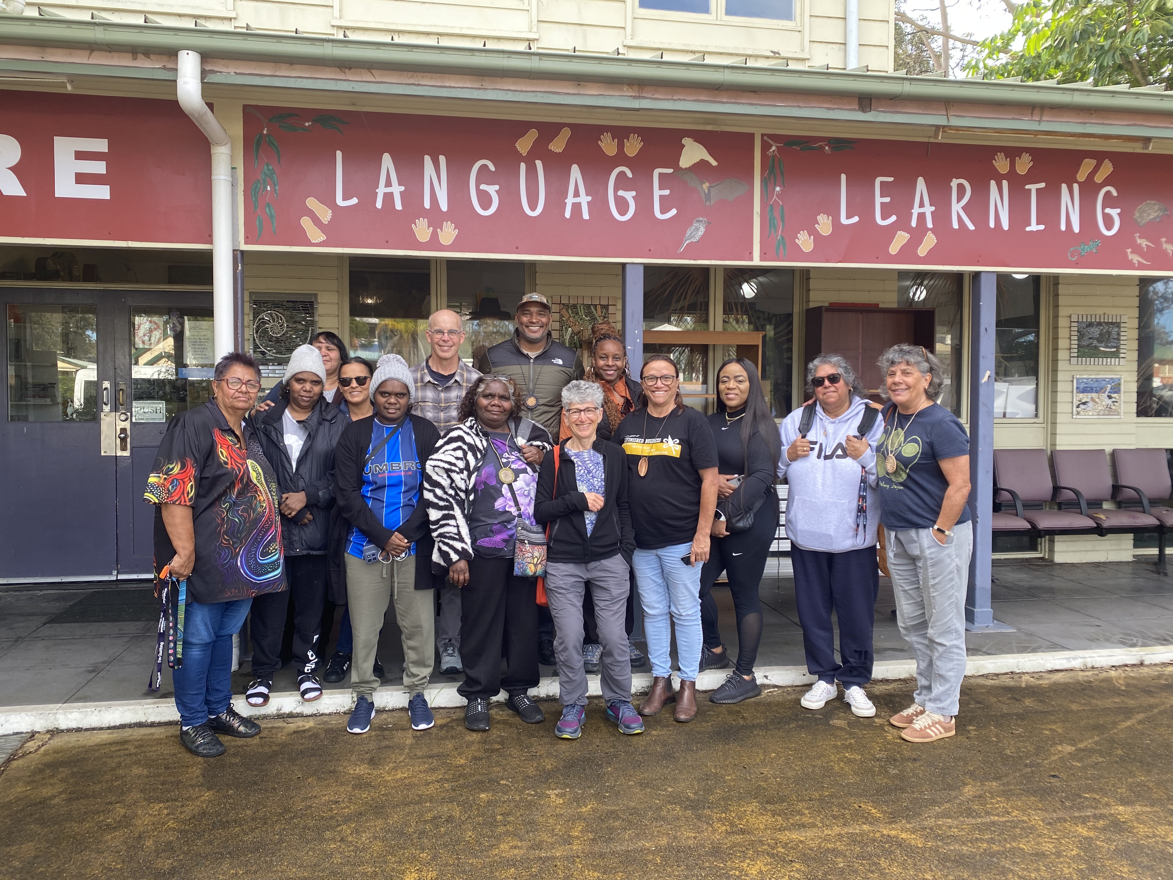 the Blak Excellence Learning Exchange participants smiling in a group photo