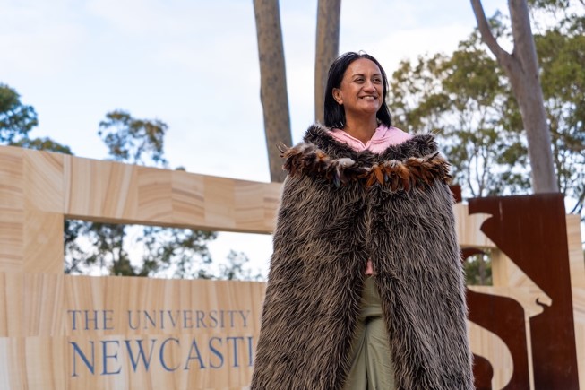Ngaio Stobbs wears traditional Korowai clock made of feathers