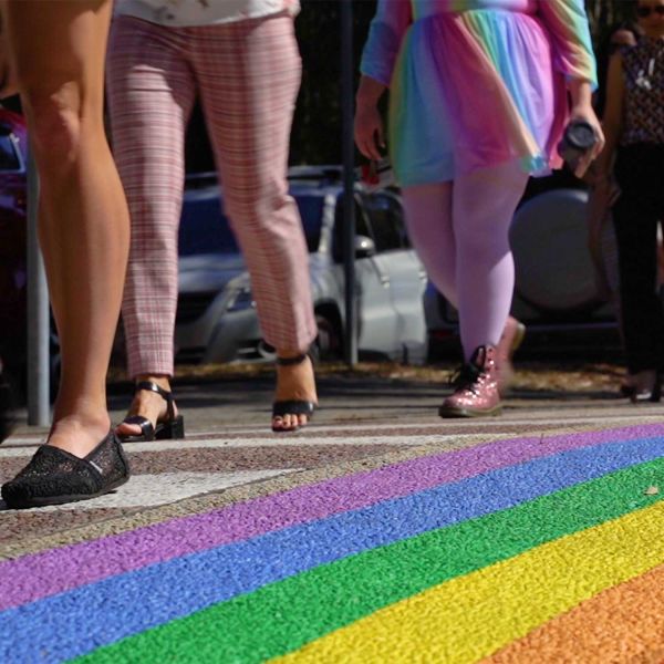 walking across pride coloured crossing
