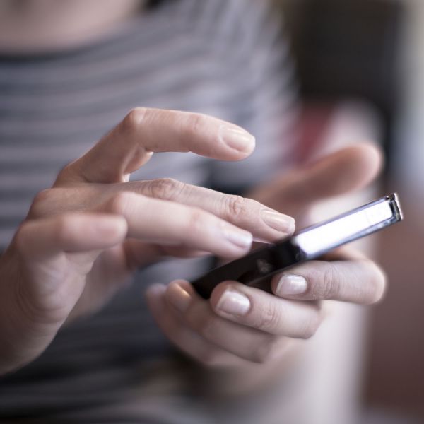 Person using phone. Innovating health care in regional Australia