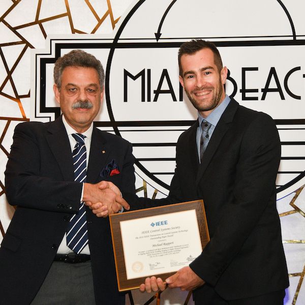 Michael Ruppert receiving best paper award at IEEE conference. Dr Michael Ruppert receives IEEE Best Paper Award