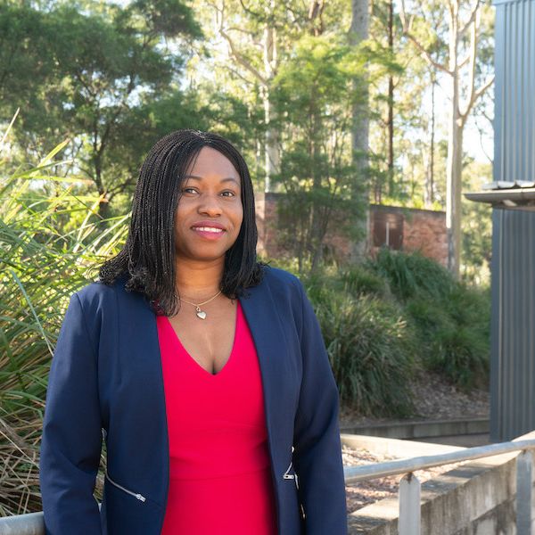 Dr Temitope Egbelakin Photo of Dr Temitope Egbelakin in front of trees smiling