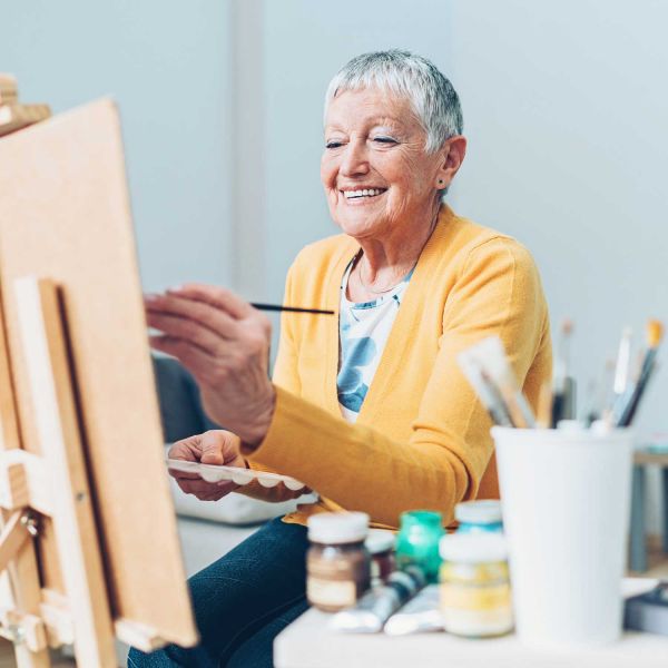 Older person painting. Researchers get creative to support healthy ageing minds