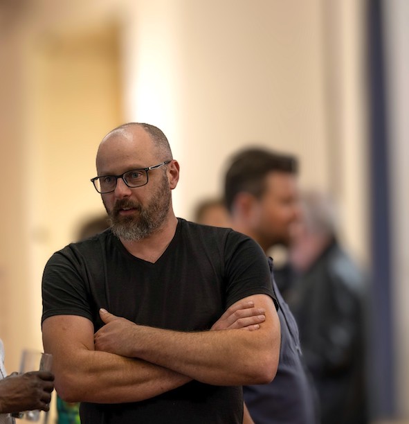 Image of Dr Matthew Bunn standing with his arms folded.