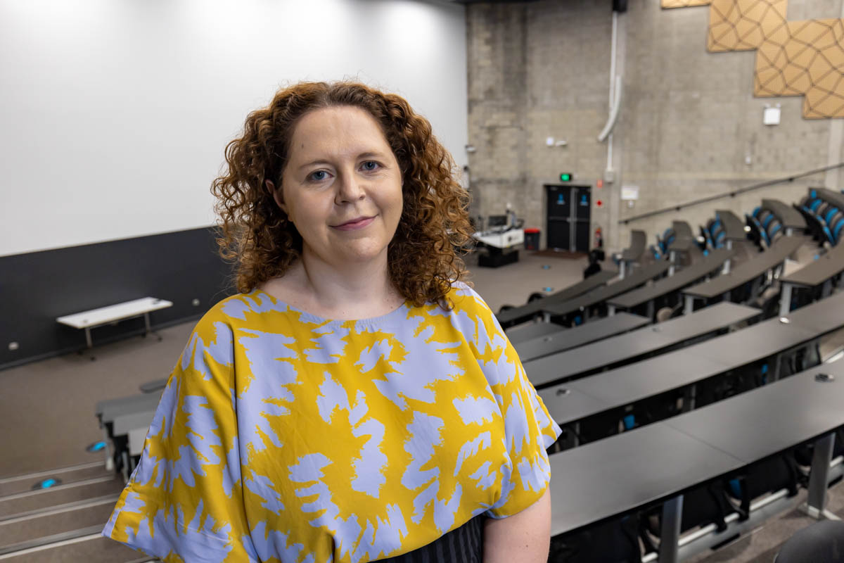 Sally Patfield standing in a lecture theatre