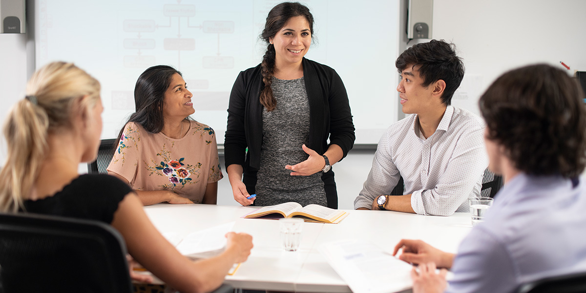 Staff talking around table