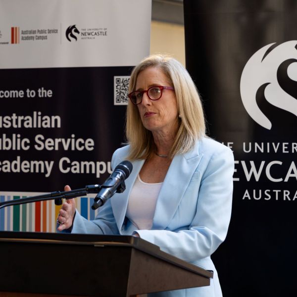 The Hon Katy Gallagher standing at a lectern speaking