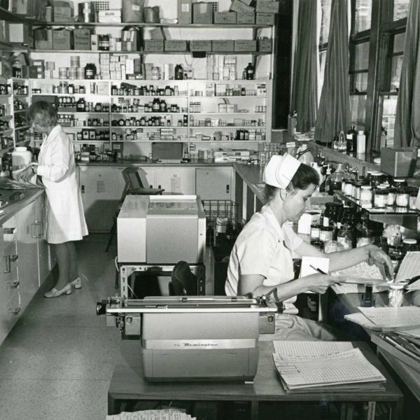 Historic image of two women working in a hospital dispensary. Generosity advancing nursing careers and alcohol research.