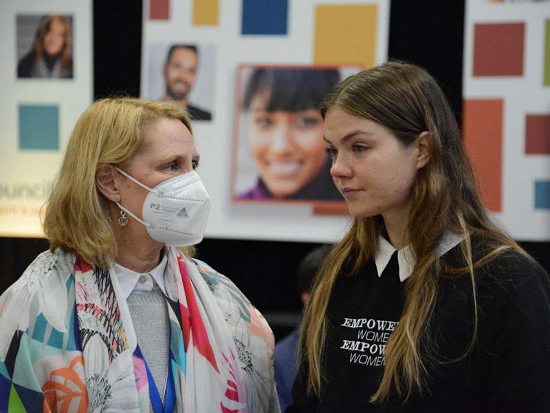 Maddy being consoled at the 2022 Plenary Council (c) Fiona Basile