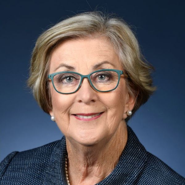 A headshot photo of the Chancellor smiling at the camera