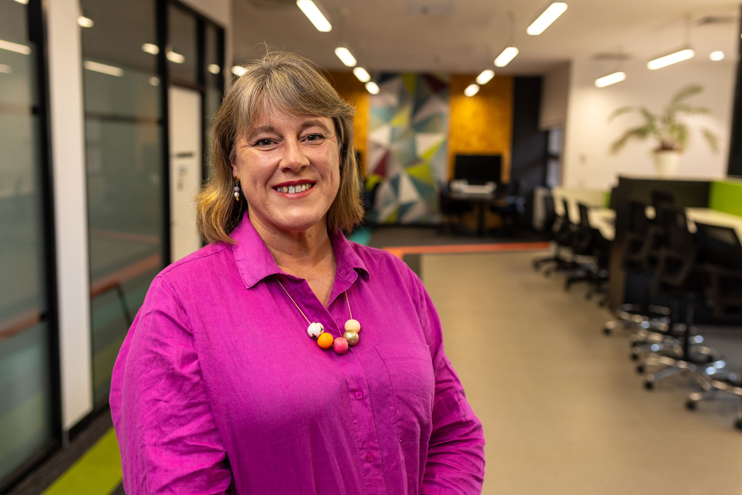 Bronwyn Relf standing in an office at Callaghan campus