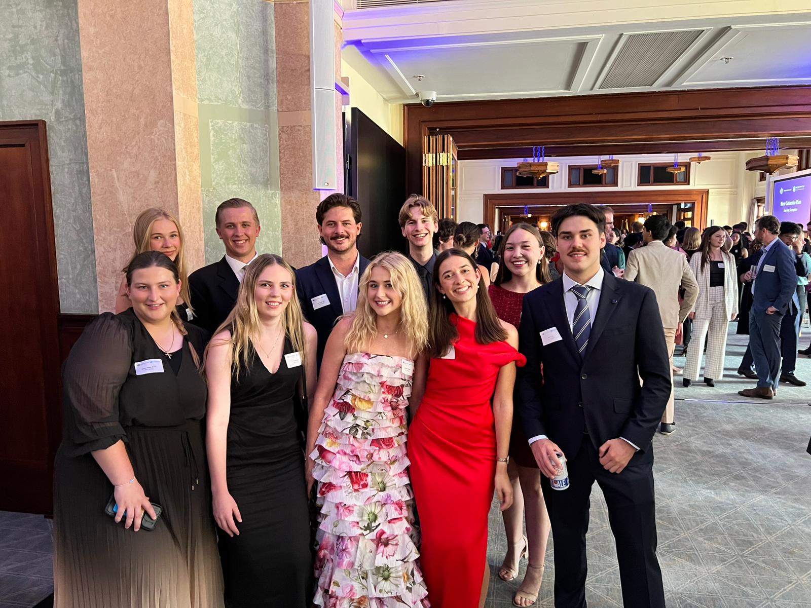 New Colombo Plan Scholars reception A group of 10 students smile for a photo at a formal event