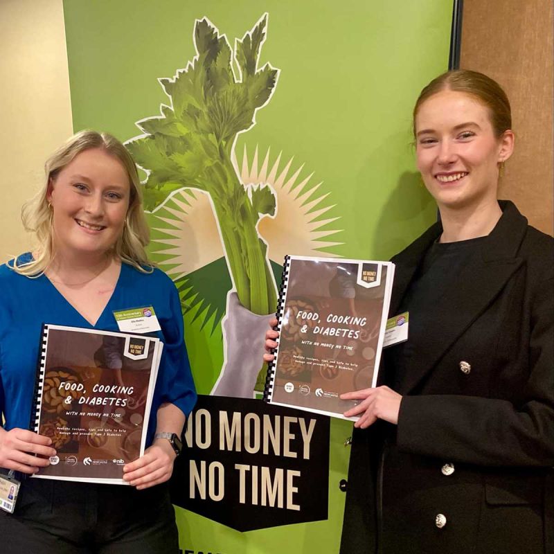 Students Ella and Emily smiling at camera