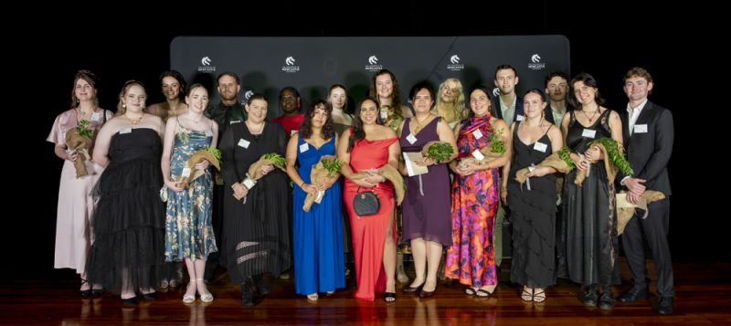 Group of students graduating standing together