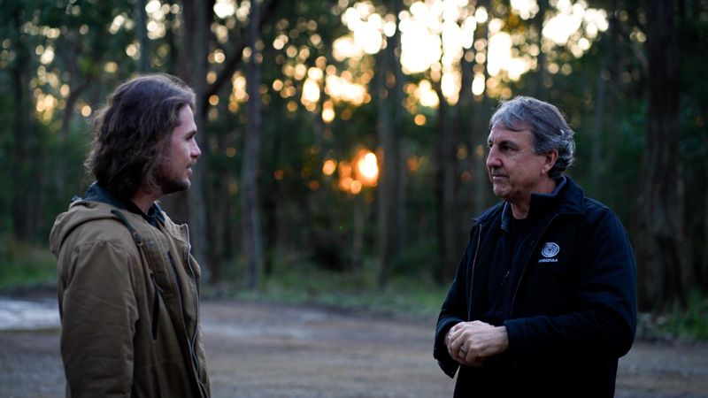 Dr Ryan Witt and Daryn McKenny pictured chatting at Sugarloaf as the sun sets