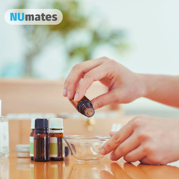 image of essential oil bottles and hands pouring oil - Monday 1 June 2026