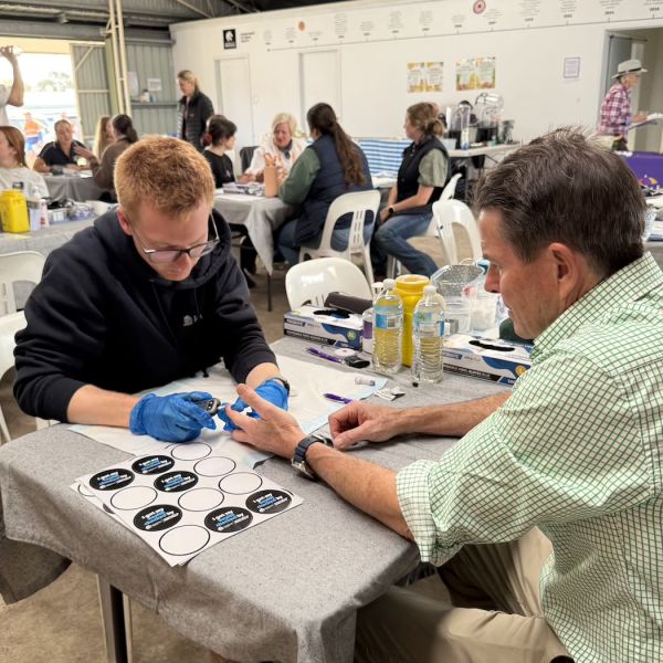 Photo of medicine student at AgQuip undertaking a health check with a community member. Rural Student Placements Help Deliver Life-Saving Care at AgQuip.