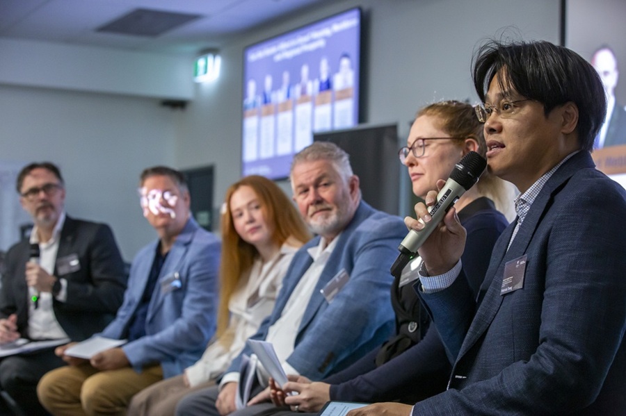 Panellists speaking at an event
