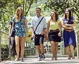 Students walking over a bridge on campus