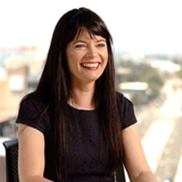 Head and shoulders photograph of a woman with long, drak hair dressed in a black dress smiling. The ‘Torres Strait 8’ versus Australia: Law Professor delivers presentation at Human Rights Day