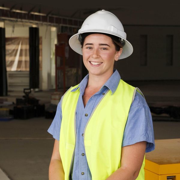 Emily Spurway pictured in a hard hat on a construction site