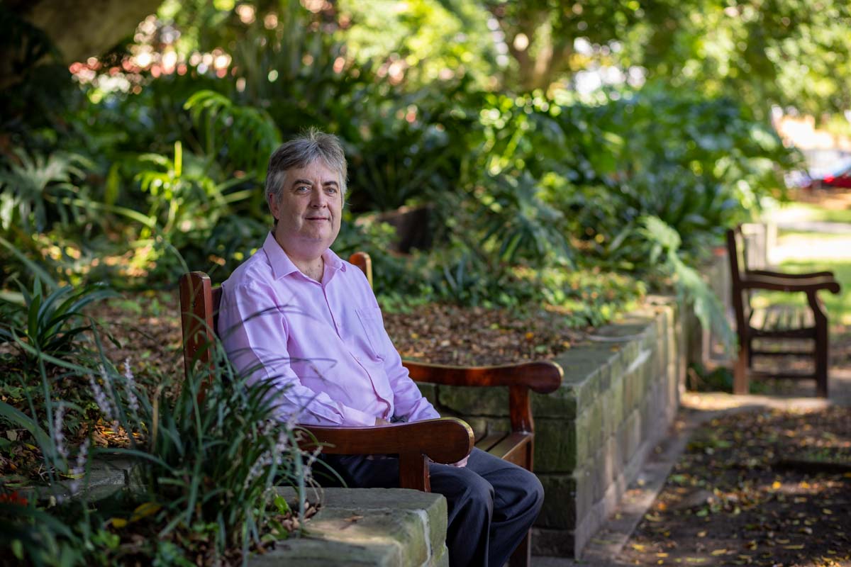 Shaun McCarthy sitting in the shade in a park
