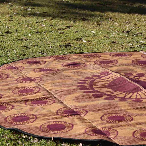 Yarning mats Photo of yellow and red yarning mat lying on green grass