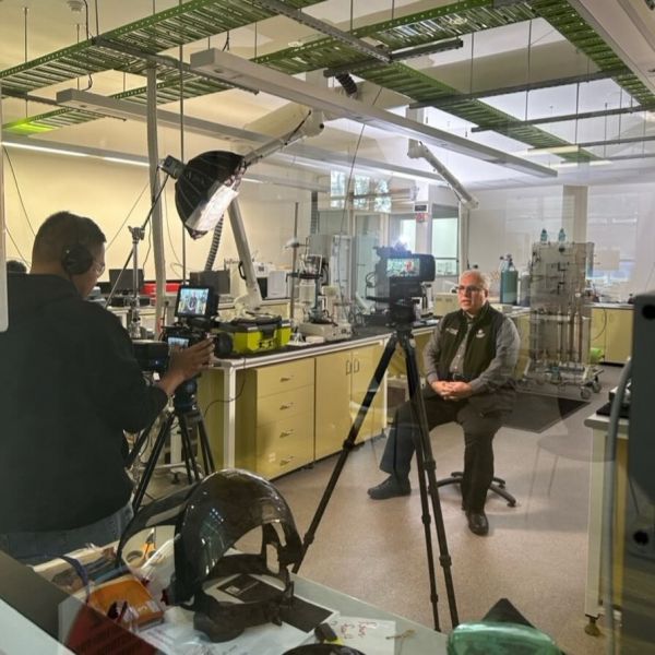 L/Prof Moghtaderi sitting in his lab at NIER, being interviewed for the ViewPoint documentary.