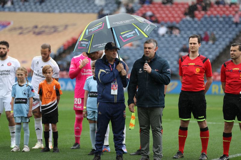 Nathan Towney presenting at a Jets game