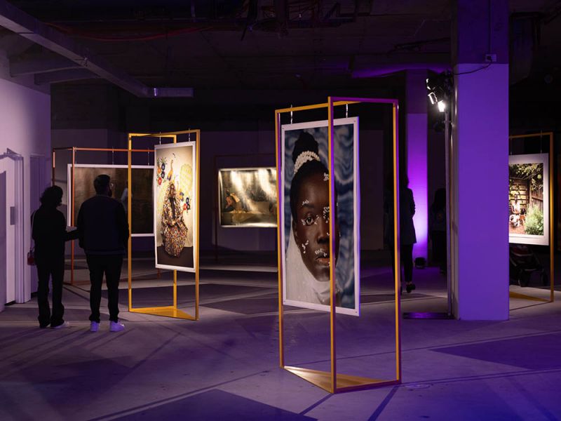 Two people looking at artworks