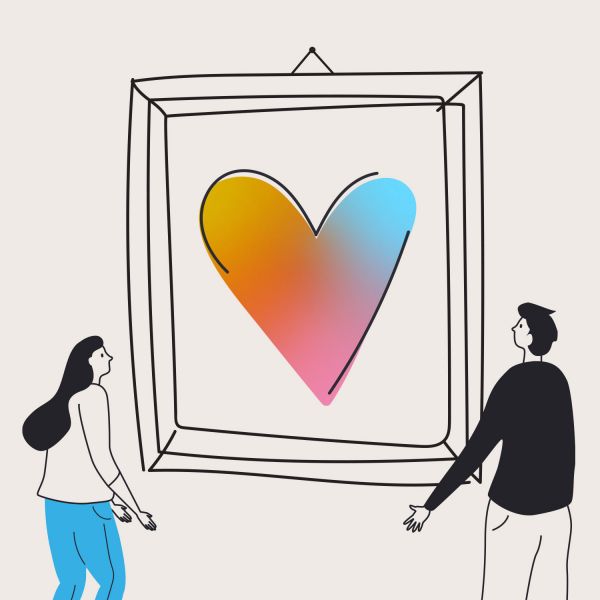 a graphic of a multicoloured heart in a frame being held by two people