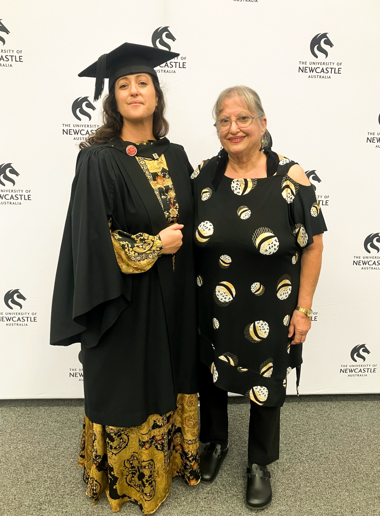 Graduate Keren Peter smiling with her mother
