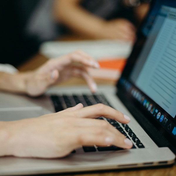 Person typing up a script on a laptop - Scriptwriting