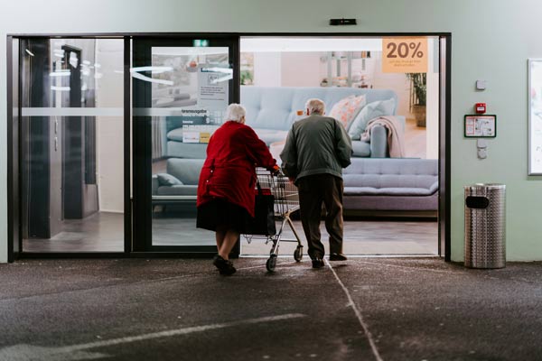 Personal-planning An elderly couple entering a store