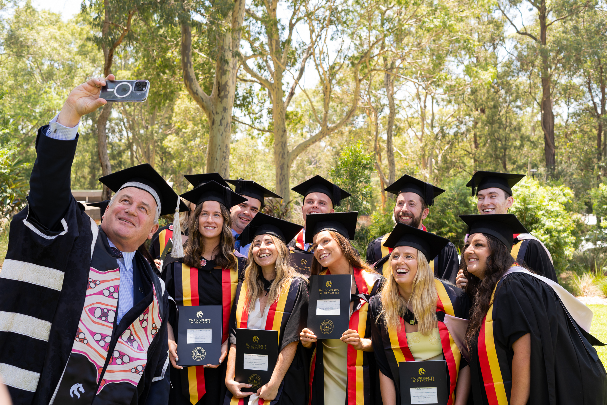 Vice Chancellor Alex Zelinsky takes selfie with group of graduating Indigenous doctors