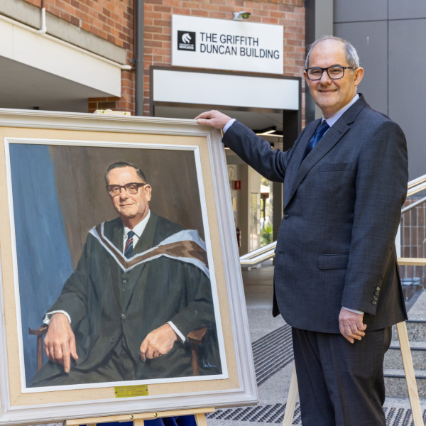 Professor Alan Broadfoot with portrait of his great uncle Griffith Duncan . University pays tribute to founding figure with building renaming .