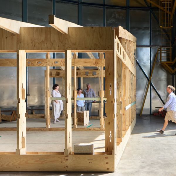 Fast Slow Project Team stand in and around their prototype. Fast Slow Project: A Sustainable Home Takes Shape at Narara Ecovillage.