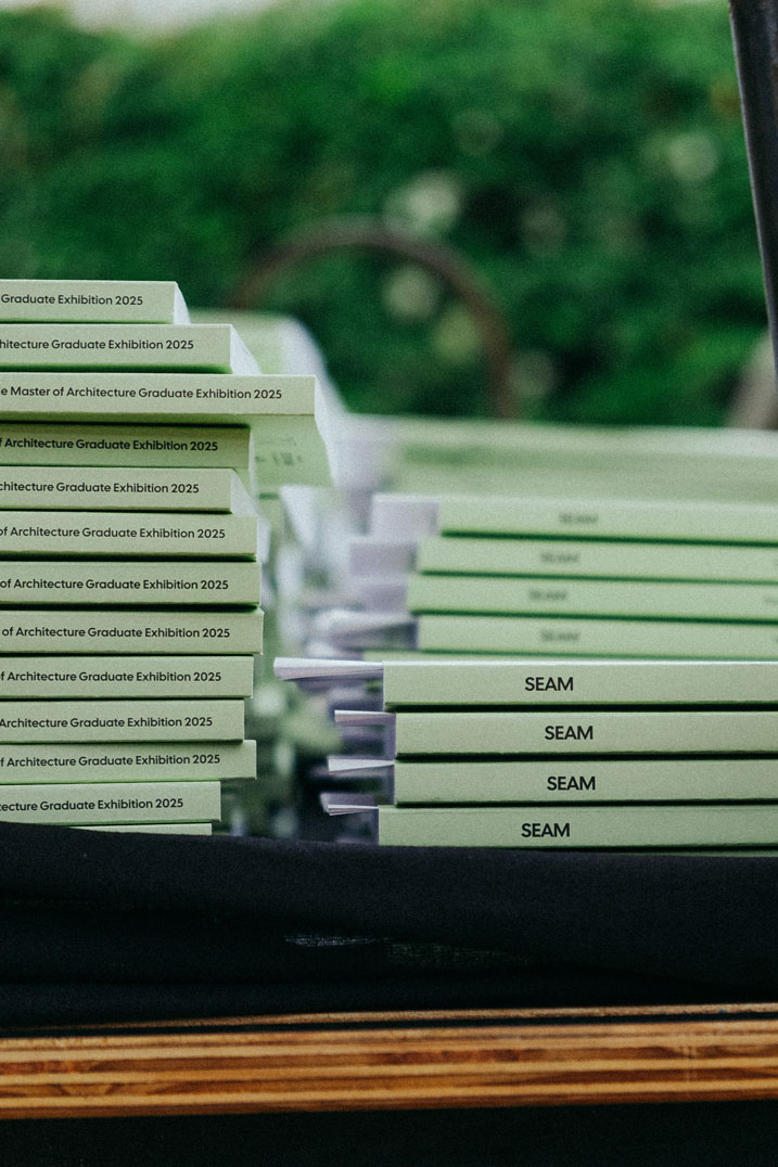 Seam books sit piled up on a table