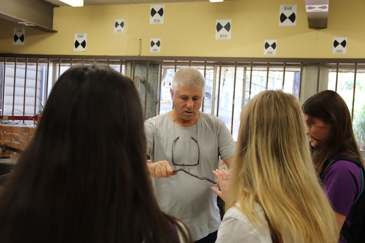 Academic shows students construction materials