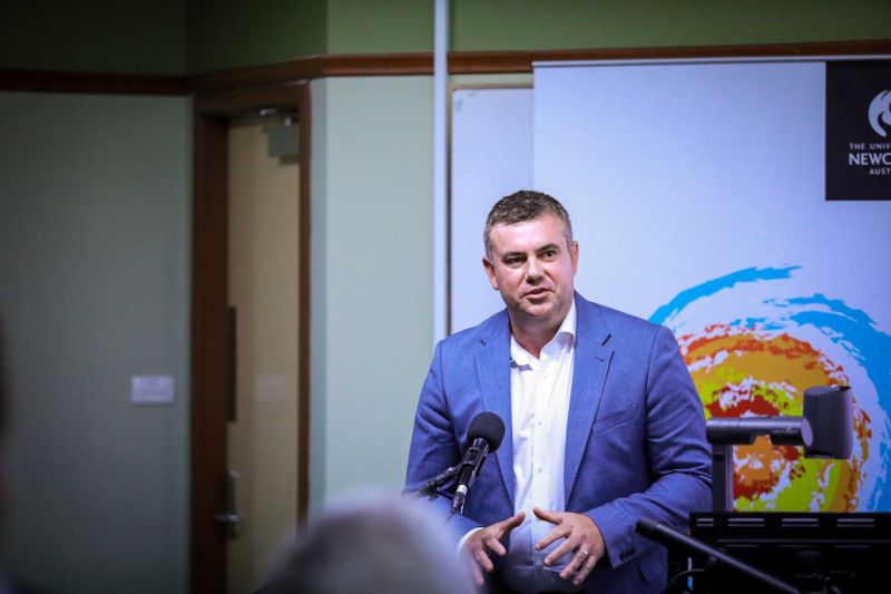 Middle-aged man talking at a lecture