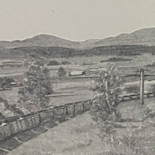 A monochrome landscape artwork depicts rolling hills, scattered trees, open fields, and a long train winding through the countryside beneath distant mountains.