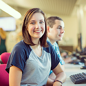 A young female student at a computer