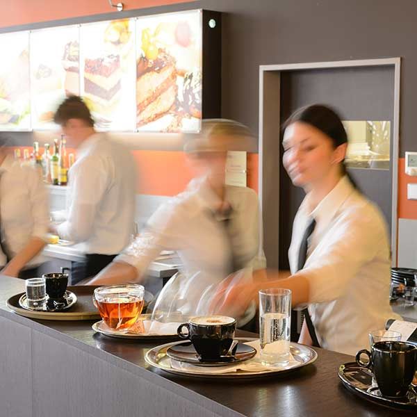 Busy bar workers. New research reveals the challenging experiences of young hospitality workers